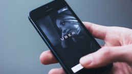 Uber app on smartphone in a hand